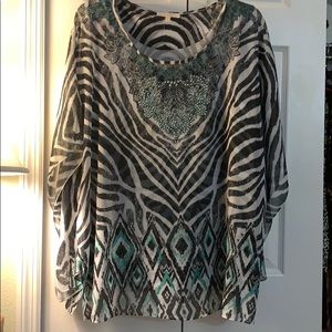 Silky pull over blouse, wrinkle free.